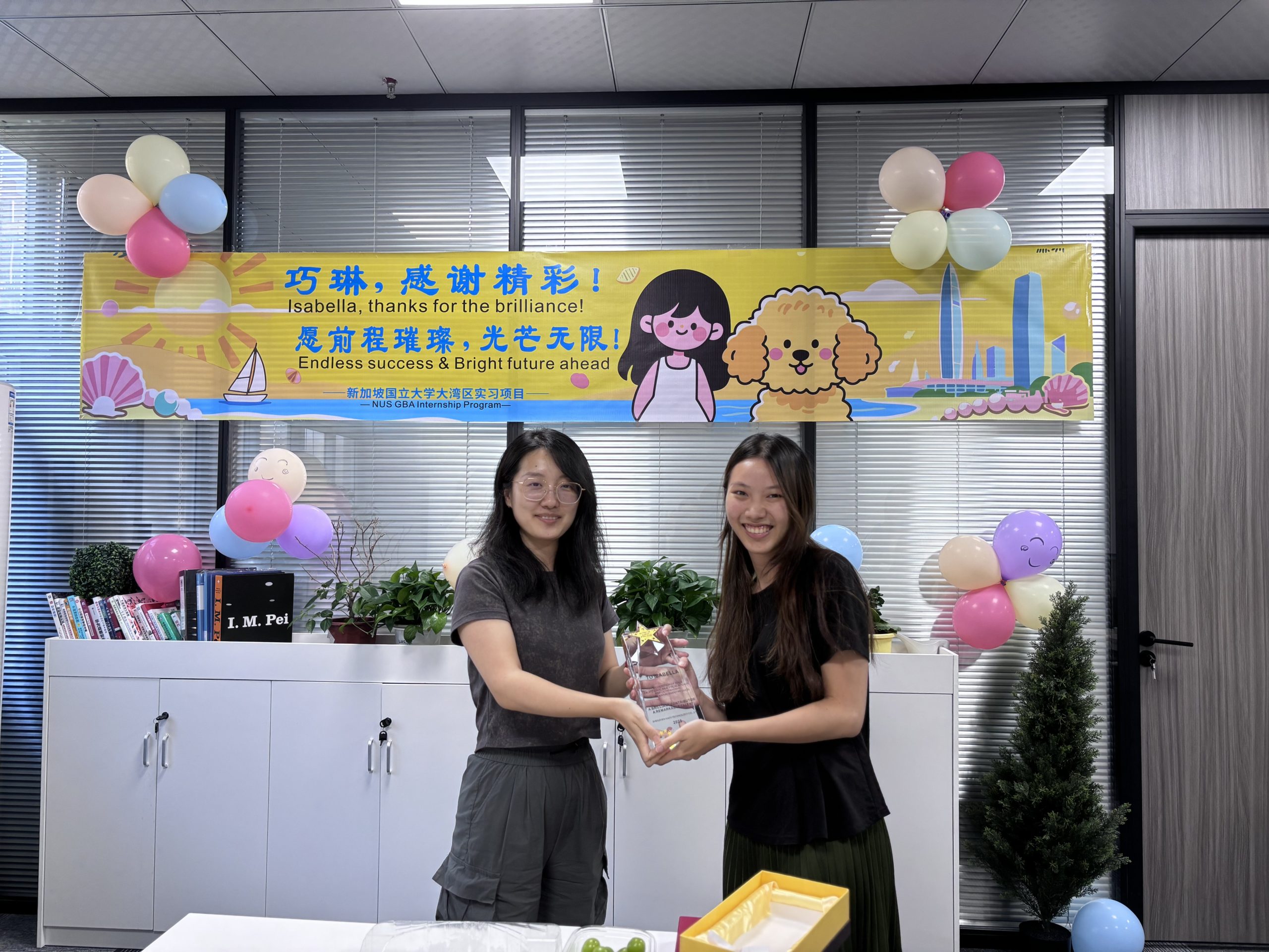 Isabella and Amanda with appreciation plaque
